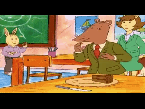 a cartoon character eating a piece of cake in a classroom