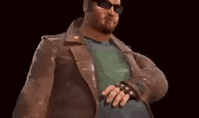 a man wearing sunglasses and a leather jacket is standing with his hands on his hips .