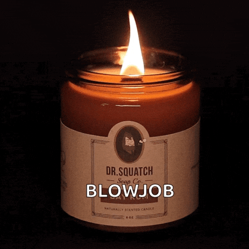 a candle that says dr. squatch soap co blowjob on it