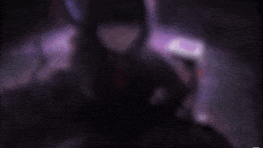 a dark purple background with a few purple circles