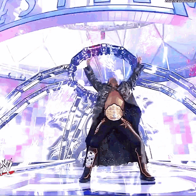 a man in a wrestling outfit is standing in front of a sign that says wrestlemania