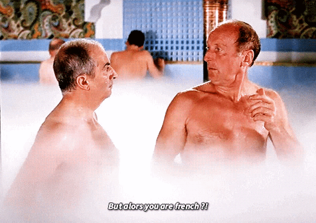 two shirtless men are talking in a bathtub with the caption but alors you are french ?