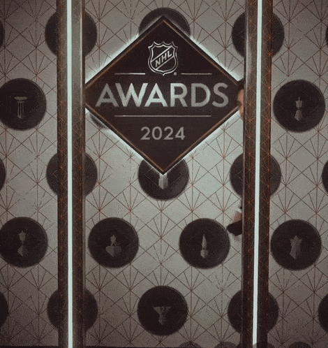a sign for the nhl awards 2024 hangs on a wall