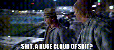 two men are standing next to each other in a parking lot and one of them is saying " shit a huge cloud of shit " .