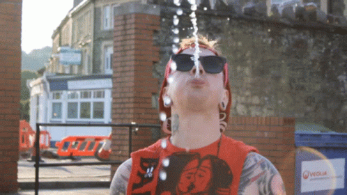 Spit Water GIF - Spit Water Sun Glasses GIFs