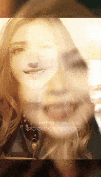 a woman 's face is shown with the words loading on the bottom right