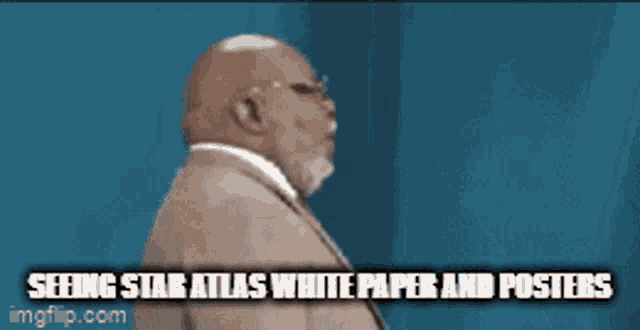 a man in a suit and tie says seeing star atlas white paper and posters ..