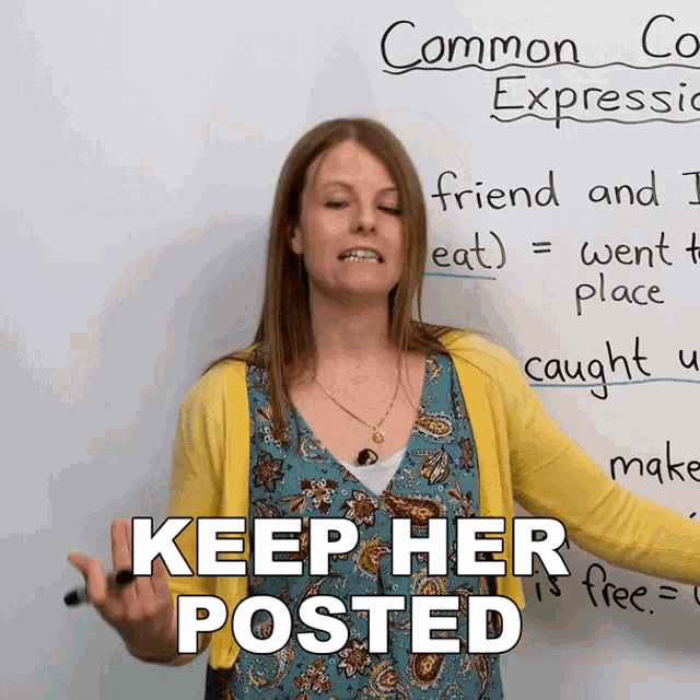 a woman stands in front of a white board with the words keep her posted written on it