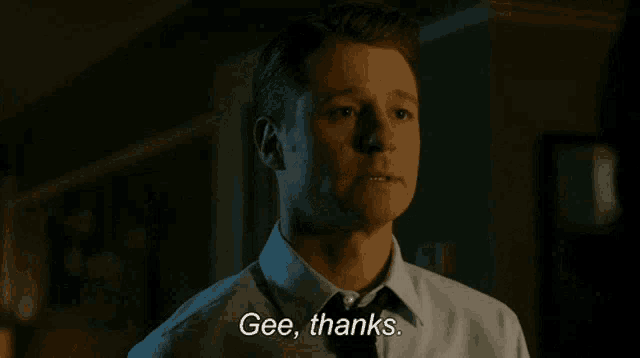 a man in a shirt and tie is saying gee thanks