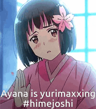 a girl with a flower in her hair is wearing a pink kimono and giving the middle finger .