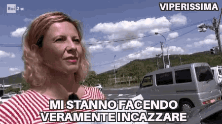a woman in a red and white striped shirt says " mi stanno facendo veramente incazze "