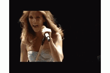 a woman is singing into a microphone with the words good night written below her
