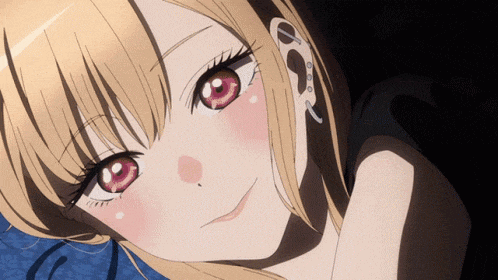 a close up of a girl with red eyes