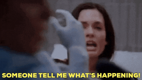 a woman is being examined by a doctor and the words " someone tell me what 's happening " are visible