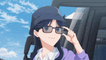 a girl wearing glasses and a hat adjusts her glasses with her finger