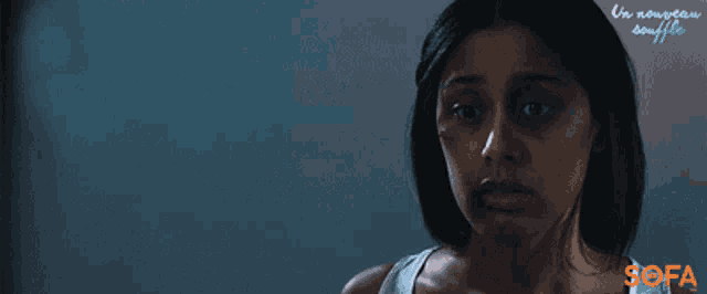 a poster for a movie called un nouveau souffle showing a woman with a black eye