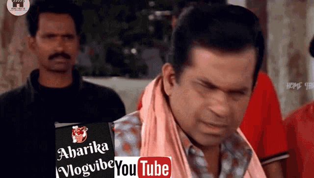 a man with a towel around his neck has a youtube logo on his shirt