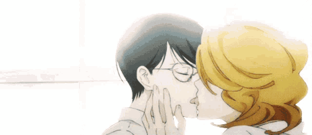 a man and a woman are kissing and the man has glasses on