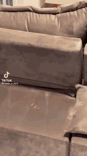 a tiktok video of a couch with the letters tk on it