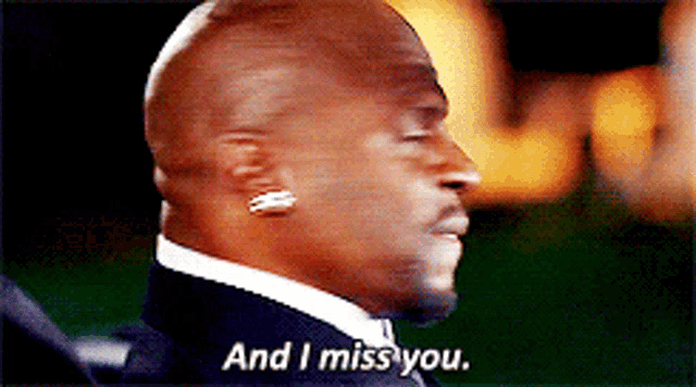a man in a suit and tie is saying " and i miss you "