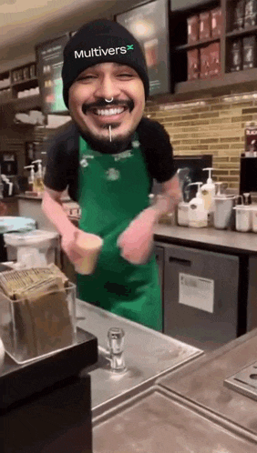 a man wearing a green apron and a black hat with multivers on it