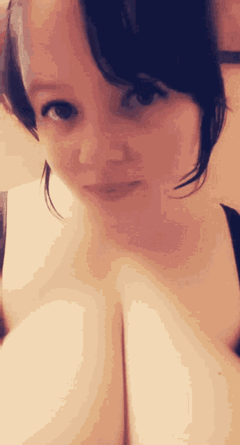 a close up of a woman 's face and chest