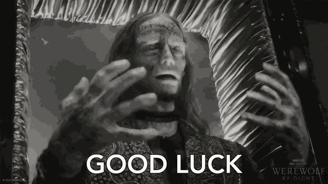 a black and white photo of a werewolf in a coffin with the caption good luck