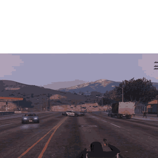 a police car is driving down a highway with a man holding a gun