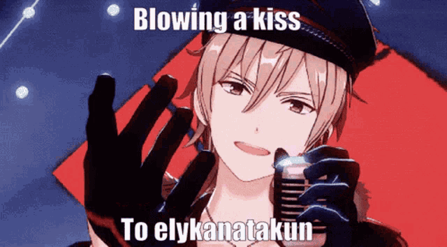 a man is blowing a kiss into a microphone