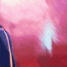 a person standing in front of a pink and red background