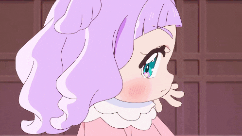 a cartoon girl with purple hair and blue eyes looks surprised