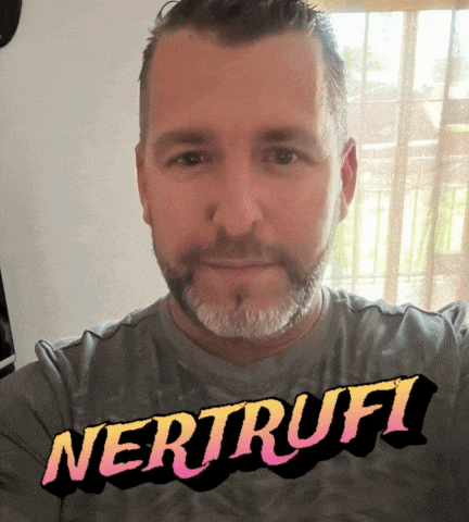 a man with a beard is wearing a shirt that says nertruffi