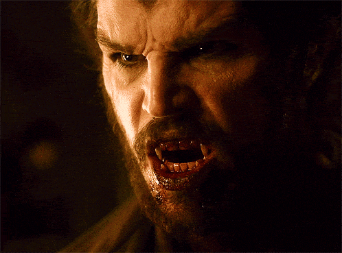a man with a beard and blood on his face