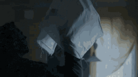 a man is holding a piece of cloth in his hand