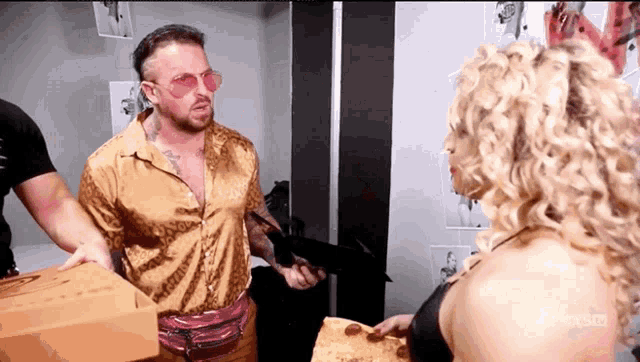 a man in a leopard print shirt is talking to a woman