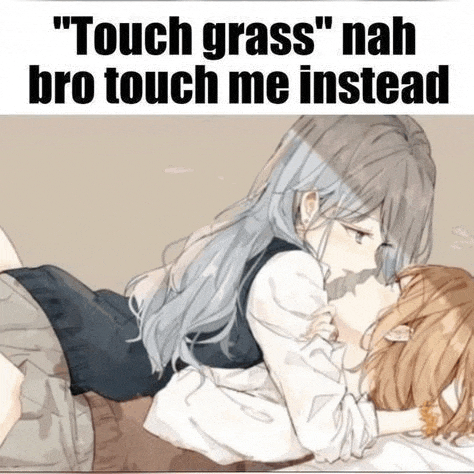 two anime girls are kissing each other on a bed .