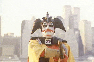a man wearing a mask with a chinese symbol on it