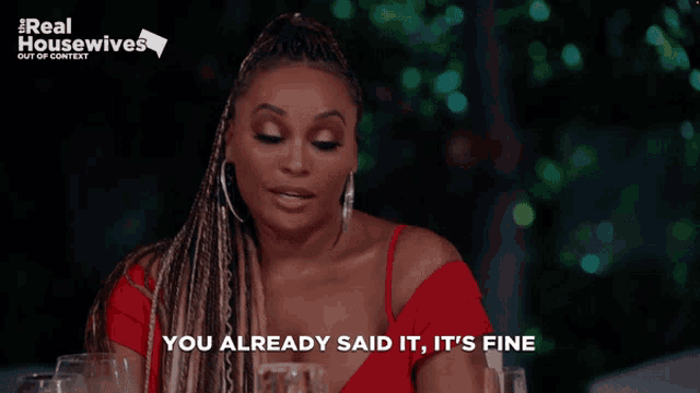a woman says you already said it it 's fine in front of a sign that says real housewives
