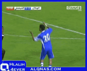 a soccer player with the number 20 on his jersey is kicking the ball