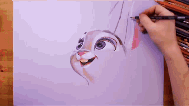 a person is drawing a cartoon rabbit with a pencil