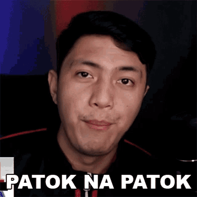 a close up of a man 's face with the words patok na patok written on the bottom .