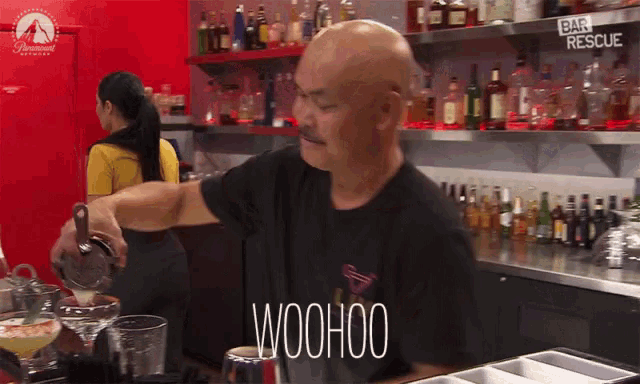 a bartender is pouring a drink and the word woohoo is visible in front of him