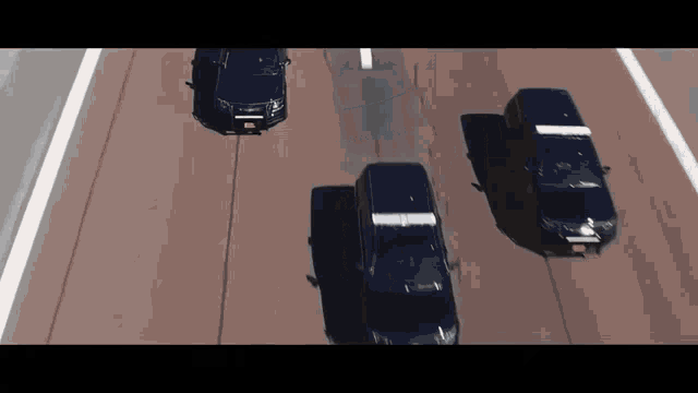 three cars are driving down a highway and one of them has a license plate that says ' jc ' on it