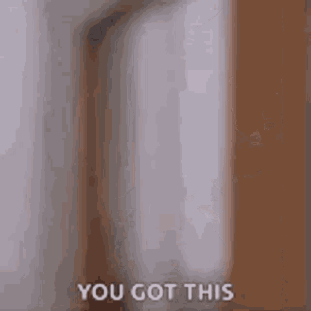a blurry picture of a man laying in bed with the words `` you got this '' written on it .