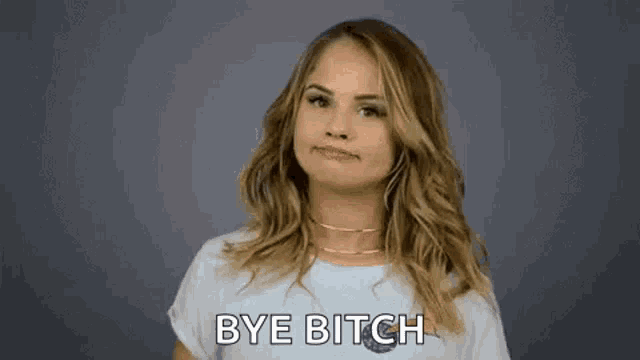 a woman is making a peace sign with her hands and saying `` bye bitch '' .