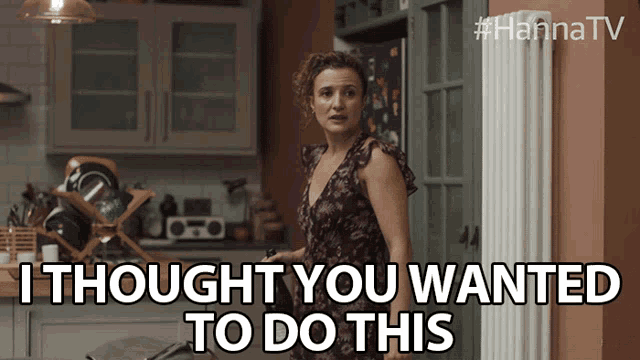 a woman standing in a kitchen with the words i thought you wanted to do this