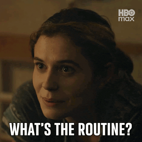 a woman laying on a bed with the words " what 's the routine " on her face