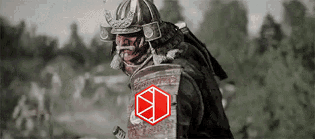 a samurai wearing a helmet and armor with a red cube on his sleeve