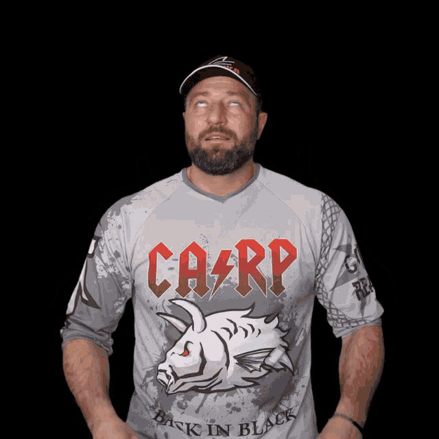 a man wearing a shirt that says carp is looking up