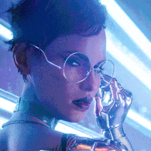 a woman wearing glasses and a robotic arm